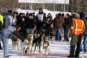 Brent Sass takes a short break amongst the crowd during the ceremonial start of the Iditarod sled dog race Anchorage Saturday, March 2, 2013. Photo (C) Jeff Schultz/IditarodPhotos.com  Do not reproduce without permission