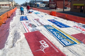 Sponsor banners are taken down and rolled up at the Nome finish line during the 2016 Iditarod.  Alaska    

Photo by Jeff Schultz (C) 2016  ALL RIGHTS RESERVED