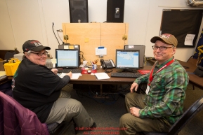 Volunteer Comms Darla Pindell and Jerry Trodden at the Nome headquarters during the 2016 Iditarod.  Alaska    

Photo by Jeff Schultz (C) 2016  ALL RIGHTS RESERVED