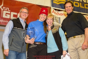 The Alaska Airlines Leonhard Seppala Humanitarian Award
is presented by Marilyn Romano, regional vice president, and Tim Thompson, manager, external affairs, with Alaska Airlines and ITC chief veterinarian Stu Nelson to Aliy Zirkle at the musher finisher's banquet in Nome during the 2016 Iditarod.  Alaska    

Photo by Jeff Schultz (C) 2016  ALL RIGHTS RESERVED
