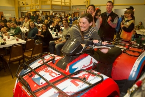 Musher Sigrid Ekran starts up and wins the Northern Air Cargo 4-wheeler giveaway at the musher awards banquet in Nome after the 2016 Iditarod.  Alaska    

Photo by Jeff Schultz (C) 2016  ALL RIGHTS RESERVED