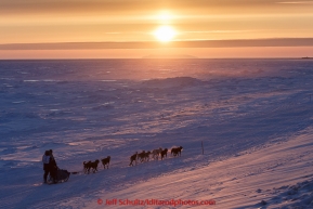 Mark Selland on the trail a few miles from Nome at sunset on Saturday March 21, 2015 during Iditarod 2015.  (C) Jeff Schultz/SchultzPhoto.com - ALL RIGHTS RESERVED DUPLICATION  PROHIBITED  WITHOUT  PERMISSION
