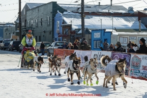 Monica Zappa runs into the chute at the finish line in Nome on Saturday March 21, 2015 during Iditarod 2015.  (C) Jeff Schultz/SchultzPhoto.com - ALL RIGHTS RESERVED DUPLICATION  PROHIBITED  WITHOUT  PERMISSION