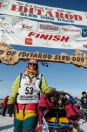 Monica Zappa poses for a photo at the finish line in Nome on Saturday March 21, 2015 during Iditarod 2015.  (C) Jeff Schultz/SchultzPhoto.com - ALL RIGHTS RESERVED DUPLICATION  PROHIBITED  WITHOUT  PERMISSION