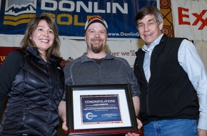 Aaron Burmeister (center) recieves the Bristol Bay Native Corporation Fish First award from Shawn Asplund and Andria Agli at the finishers banquet in Nome on Sunday  March 22, 2015 during Iditarod 2015.  (C) Jeff Schultz/SchultzPhoto.com - ALL RIGHTS RESERVED DUPLICATION  PROHIBITED  WITHOUT  PERMISSION