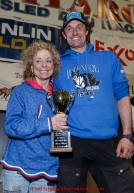 Thomas Waerner recieves the Jerry Austin Rookie of the year award from DeeDee Jonrowe at the finishers banquet in Nome on Sunday  March 22, 2015 during Iditarod 2015.  (C) Jeff Schultz/SchultzPhoto.com - ALL RIGHTS RESERVED DUPLICATION  PROHIBITED  WITHOUT  PERMISSION