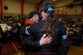 Brothers, Jason and Lance Mackey hug after they both recieved special sportsmanship awards at the finishers banquet in Nome on Sunday  March 22, 2015 during Iditarod 2015.  (C) Jeff Schultz/SchultzPhoto.com - ALL RIGHTS RESERVED DUPLICATION  PROHIBITED  WITHOUT  PERMISSION