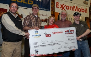 The four major Iditarod sponsors award the $70,000 winner check to 2015 Iditarod champion Dallas Seavey at the finishers banquet in Nome on Sunday  March 22, 2015 during Iditarod 2015.  (C) Jeff Schultz/SchultzPhoto.com - ALL RIGHTS RESERVED DUPLICATION  PROHIBITED  WITHOUT  PERMISSION