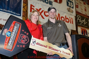 Anchorage Chrysler Dodge sponsor hads the keys to a new dodge pickup to 2015 Iditarod champion Dallas Seavey  at the finishers banquet in Nome on Sunday  March 22, 2015 during Iditarod 2015.  (C) Jeff Schultz/SchultzPhoto.com - ALL RIGHTS RESERVED DUPLICATION  PROHIBITED  WITHOUT  PERMISSION