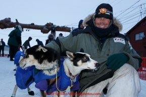 Lachlan Clarke poses with his lead dogs in the finish chute at  Nome on Sunday  March 22, 2015 during Iditarod 2015.  (C) Jeff Schultz/SchultzPhoto.com - ALL RIGHTS RESERVED DUPLICATION  PROHIBITED  WITHOUT  PERMISSION