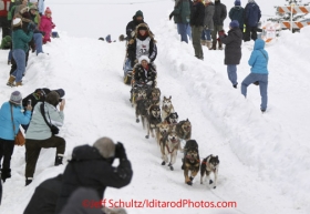 Saturday, March 3, 2012  Anna Berrington, her Idit-A-Rider, her handler and her dog team head down Cordova Hill during the Ceremonial Start of Iditarod 2012 in Anchorage, Alaska.