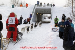 Saturday, March 3, 2012  Bob Chulpach and his dog team head into a tunnel near the Alaska Native Hospital during the Ceremonial Start of Iditarod 2012 in Anchorage, Alaska.