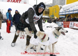 Saturday, March 3, 2012  Wade Marrs and his dog Louie (right) at the start line of the Ceremonial Start of Iditarod 2012 in Anchorage, Alaska.