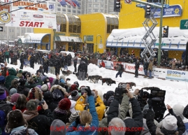 Saturday, March 3, 2012  The crowd is massive as they line 4th avenue to watch 2011 Iditarod champion John Baker leave the Ceremonial Start of Iditarod 2012 in Anchorage, Alaska.