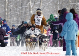 Saturday, March 3, 2012  Five-time Iditarod winner, Rick Swenson, shakes hands with fans at the Ceremonial Start of Iditarod 2012 in Anchorage, Alaska.