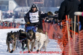 Ramey Smyth runs down the chute on Willow Lake after leaving the re-start line of the Iditarod sled dog race in Willow, Alaska Sunday, March 3, 2013.