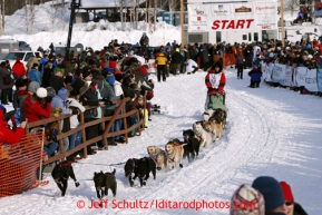 Ray Redington Jr. leaves the start line on Willow Lake during the re-start of the Iditarod sled dog race Sunday, March 3, 2013.