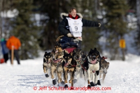 Kelley Griffin runs on Long Lake past picnicing spectators during the restart of the Iditarod sled dog race in Willow, Alaska Sunday, March 3, 2013.