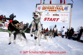 Wade Marrs dog leaps to leave the start line on Willow Lake during the re-start of the Iditarod sled dog race Sunday, March 3, 2013.