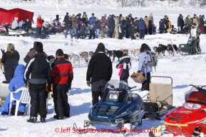 Sunday, March 4, 2012  Ray Redington, Jr. on Long Lake with a crowd of spectators at the restart of Iditarod 2012 in Willow, Alaska.