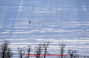 Sunday, March 4, 2012  A dog team traveled along the Yentna River after departing the restart of Iditarod 2012 in Willow, Alaska.