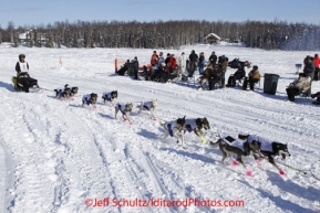 Sunday, March 4, 2012  Nicolas Petit passes a group of spectators on Long Lake at the restart of Iditarod 2012 in Willow, Alaska.