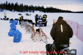 Jim Lanier of Chugiak waits in line as other teams check in at the Finger Lake checkpoint Monday, March 4, 2013.