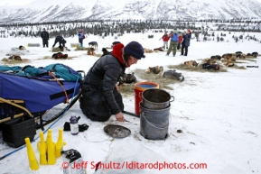 Michelle Phillips gets food ready for her dogs at Rainy Pass checkpoint March 4, 2013.