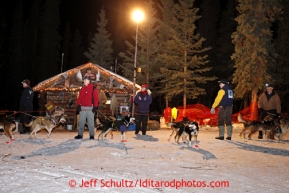 Volunteers hold Michele Phillips dogs at the Rohn checkpoint during the 2013 Iditarod sled Dog Race   March 4, 2013.

Photo by Jeff Schultz Do Not Reproduce without permission