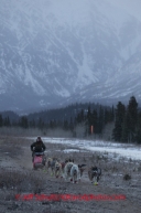 Marcelle Fressineau runs on the bare ground along the airstrip a the Rohn Checkpoint on Tuesday March 4 during Iditarod 2014 . PHOTO BY JEFF SCHULTZ/IDITARODPHOTOS.COM  USE ONLY WITH PERMISSION