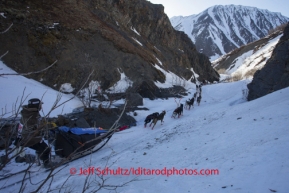 Robert Sorlie chases Jeff King through a narrow section of the trail on Pass Creek shortly after the summit of Rainy Pass