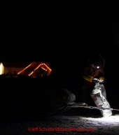 Monday March 5, 2012  A musher opens a gear bag in the early morning at the Finger Lake checkpoint during Iditarod 2012.