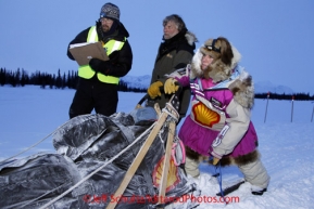 Monday March 5, 2012  DeeDee Jonrowe checking into the Finger Lake checkpoint during Iditarod 2012. Checking her in are Mark Lindstrom and Tim Johnson.