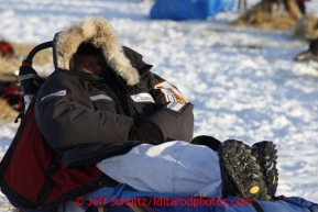 Ramey Smyth sleeps on his sleep at the Nikolai checkpoint March 5, 2013.