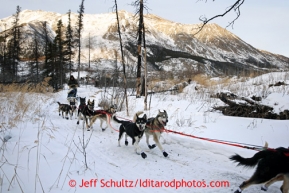 Rudy Demoski runs in a burn area of the trail after leaving the Rohn checkpoint on the way to Nikolai during the 2013 Iditarod sled Dog Race   March 5, 2013.Photo by Jeff Schultz Do Not Reproduce without permission