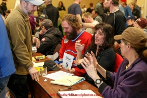 Michelle Phillips talks with other  mushers during the mandatory musher meeting on Thursday March 5, 2015 at the Millennium Hotel race headquarters in Anchorage.  Iditarod 2015 (C) Jeff Schultz/SchultzPhoto.com - ALL RIGHTS RESERVED DUPLICATION  PROHIBITED  WITHOUT  PERMISSION