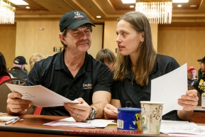 Husband and wife mushers Allen Moore and Aliy Zirkle discuss meeting notes at the mandatory musher meeting on Thursday March 5, 2015 at the Millennium Hotel race headquarters in Anchorage.  Iditarod 2015 (C) Jeff Schultz/SchultzPhoto.com - ALL RIGHTS RESERVED DUPLICATION  PROHIBITED  WITHOUT  PERMISSION