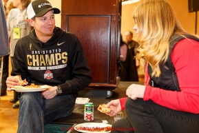 Iditarod musher Matt Failor has lunch with his Iditarider Bobby Hjelgren at the mandatory musher meeting on Thursday March 5, 2015 at the Millennium Hotel race headquarters in Anchorage.  Iditarod 2015 (C) Jeff Schultz/SchultzPhoto.com - ALL RIGHTS RESERVED DUPLICATION  PROHIBITED  WITHOUT  PERMISSION