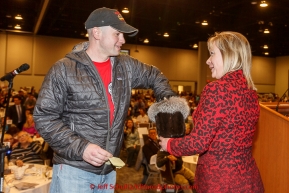 Rookie musher Seth Barnes draws his starting position number 23 at the musher banquet & drawing on Thursday March 5, 2015 at the Denaina Center in Anchorage, Alaska.  Iditarod 2015 (C) Jeff Schultz/SchultzPhoto.com - ALL RIGHTS RESERVED DUPLICATION  PROHIBITED  WITHOUT  PERMISSION