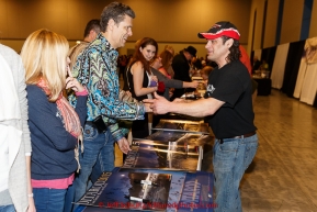 Musher Hugh Neff interact with race fans as he signs autographs at the musher banquet & drawing on Thursday March 5, 2015 at the Denaina Center in Anchorage, Alaska.  Iditarod 2015 (C) Jeff Schultz/SchultzPhoto.com - ALL RIGHTS RESERVED DUPLICATION  PROHIBITED  WITHOUT  PERMISSION