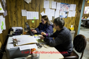 Vounteer Comms send dog traffic at Nikolai on Wednesday March 5 during the 2014 Iditarod.  PHOTO BY JEFF SCHULTZ / IDITARODPHOTOS.COM   DO NOT REPRODUCE WITHOUT PERMISSION