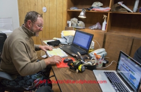 Volunteer Comm's Rob Johnson works the communication desk at McGrath on Wednesday March 5 during the 2014 IditarodPHOTO BY JEFF SCHULTZ / IDITARODPHOTOS.COM  DO NOT REPRODUCE WITHOUT PERMISSION