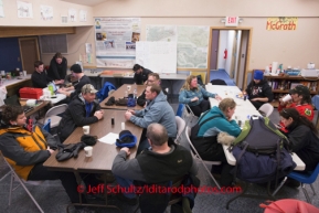 Musher 's , volunteers and locals hang out at the McGrath checkpoint on the afternoon of Wednesday March 5 during the 2014 IditarodPHOTO BY JEFF SCHULTZ / IDITARODPHOTOS.COM  DO NOT REPRODUCE WITHOUT PERMISSION