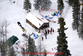 Tuesday March 6, 2012 Volunteers at the Rohn checkpoint gather for a group aerial photo outside the checkpoint BLM cabin   Iditarod 2012.