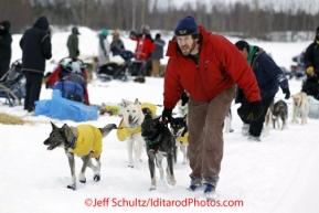 Tuesday March 6, 2012  Volunteer Zach Issacs parks a team at the Nikolai checkpoint, Iditarod 2012.