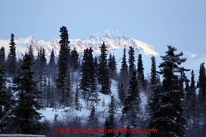 Tuesday March 6, 2012  Dawn breaks onto the Alaska Range in the morning at the Rainy Pass checkpoint, Iditarod 2012.