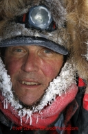 Tuesday March 6, 2012  Musher Bob Chlupach is frosted up in the morning at the Rainy Pass checkpoint, Iditarod 2012.