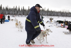 Tuesday March 6, 2012  Nikolai resident Douglas Tony  parks Jim Lanier's dogs at the  Nikolai checkpoint, Iditarod 2012.