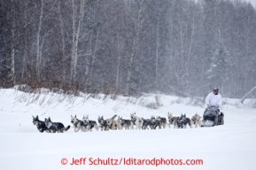 Linwood Fiedler runs on the Takotna River in a heavy snowfall 2 miles from the checkpoint on Wednesday March 6, 2013.Iditarod Sled Dog Race 2013Photo by Jeff Schultz copyright 2013 DO NOT REPRODUCE WITHOUT PERMISSION