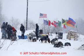 Jason Mackey checks in and out of the Takotna checkpoint just before dawn on Wednesday March 6, 2013.Iditarod Sled Dog Race 2013Photo by Jeff Schultz copyright 2013 DO NOT REPRODUCE WITHOUT PERMISSION